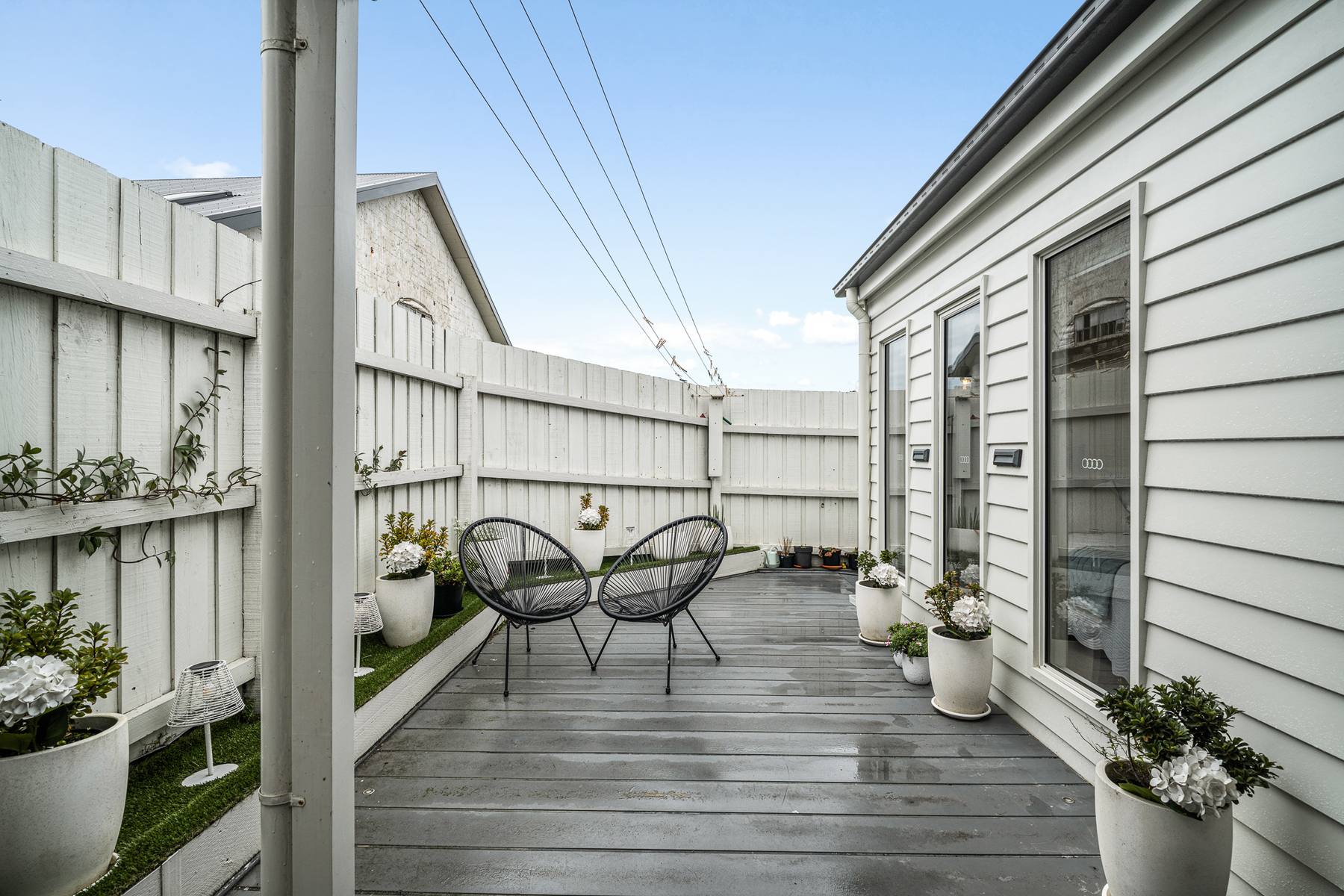Indoor outdoor living opening onto a deck